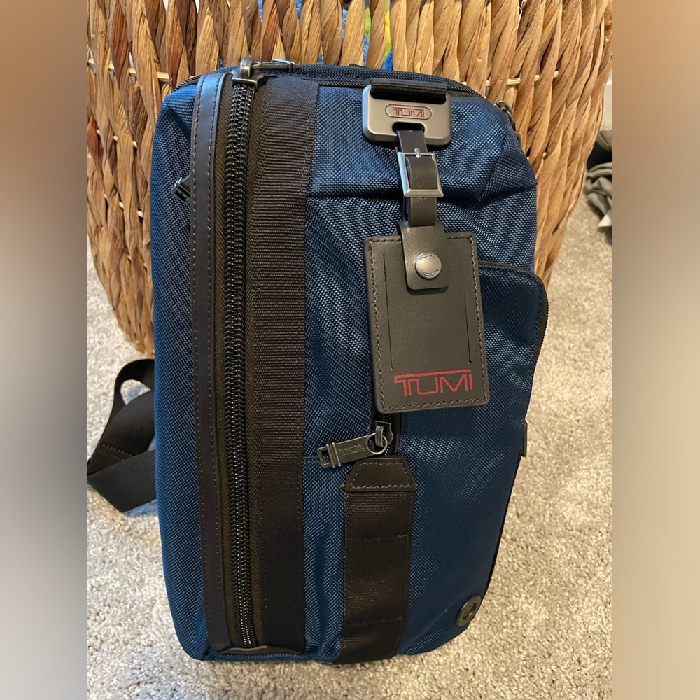 TUMI authentic sling pack, near-new condition, blue color